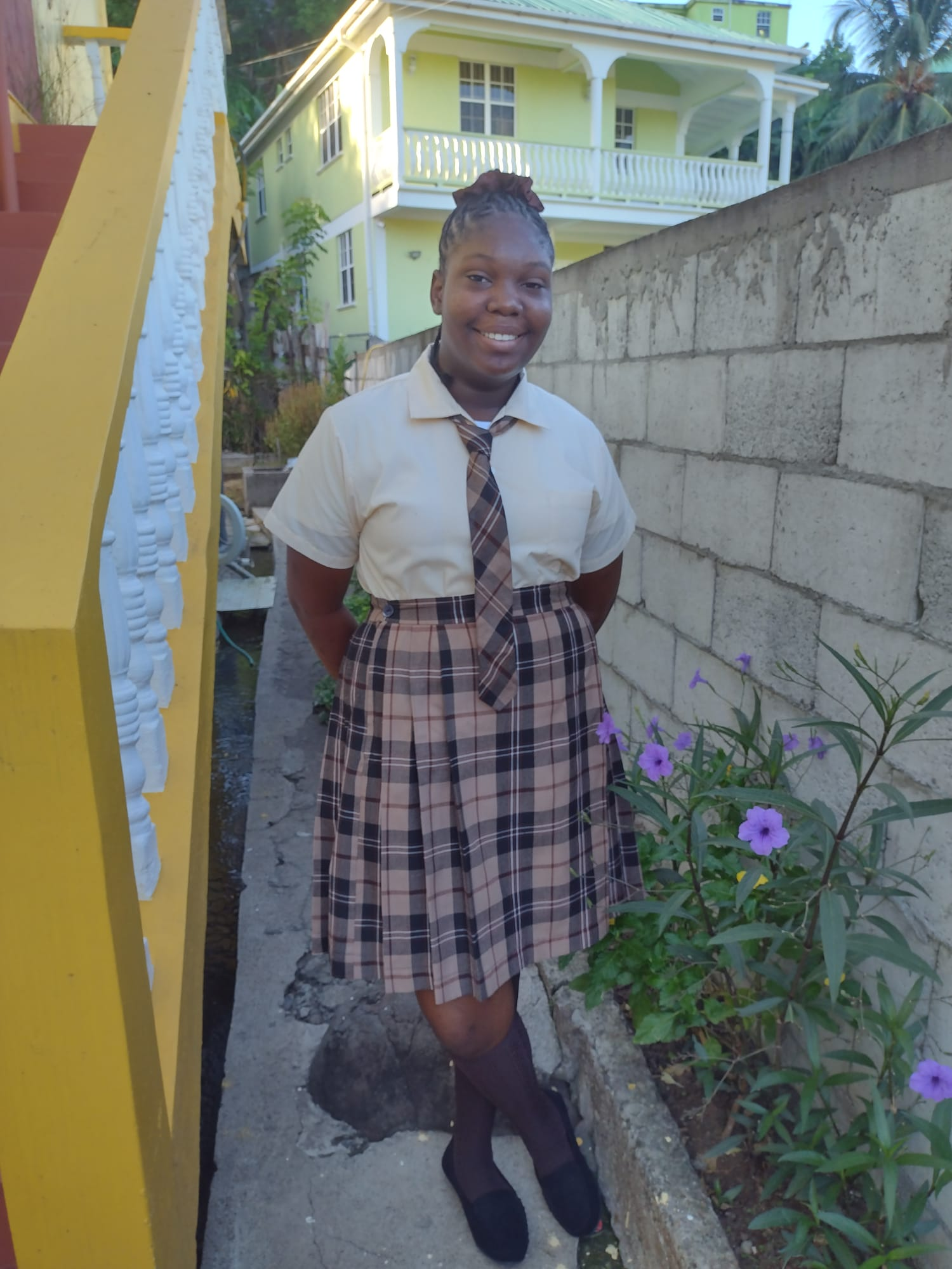 Portrait of Mateo, a 15 year old boy from Dominica smiling